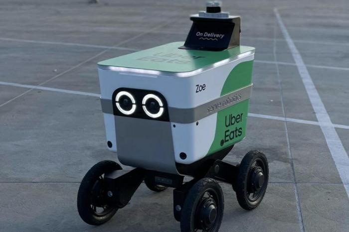 Uber eats is launching a delivery service with cartkens sidewalk robots in japan