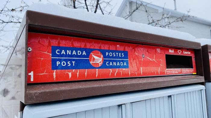 Canada post quits the home delivery game